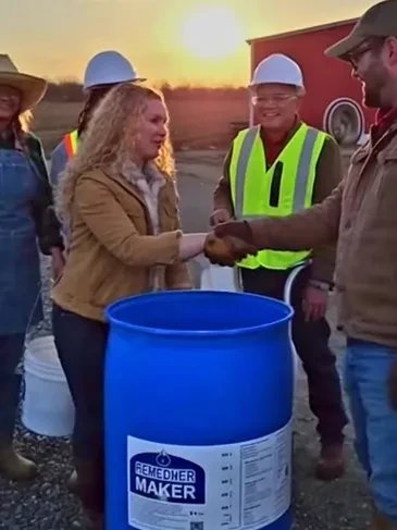 Construction workers handshake sunset