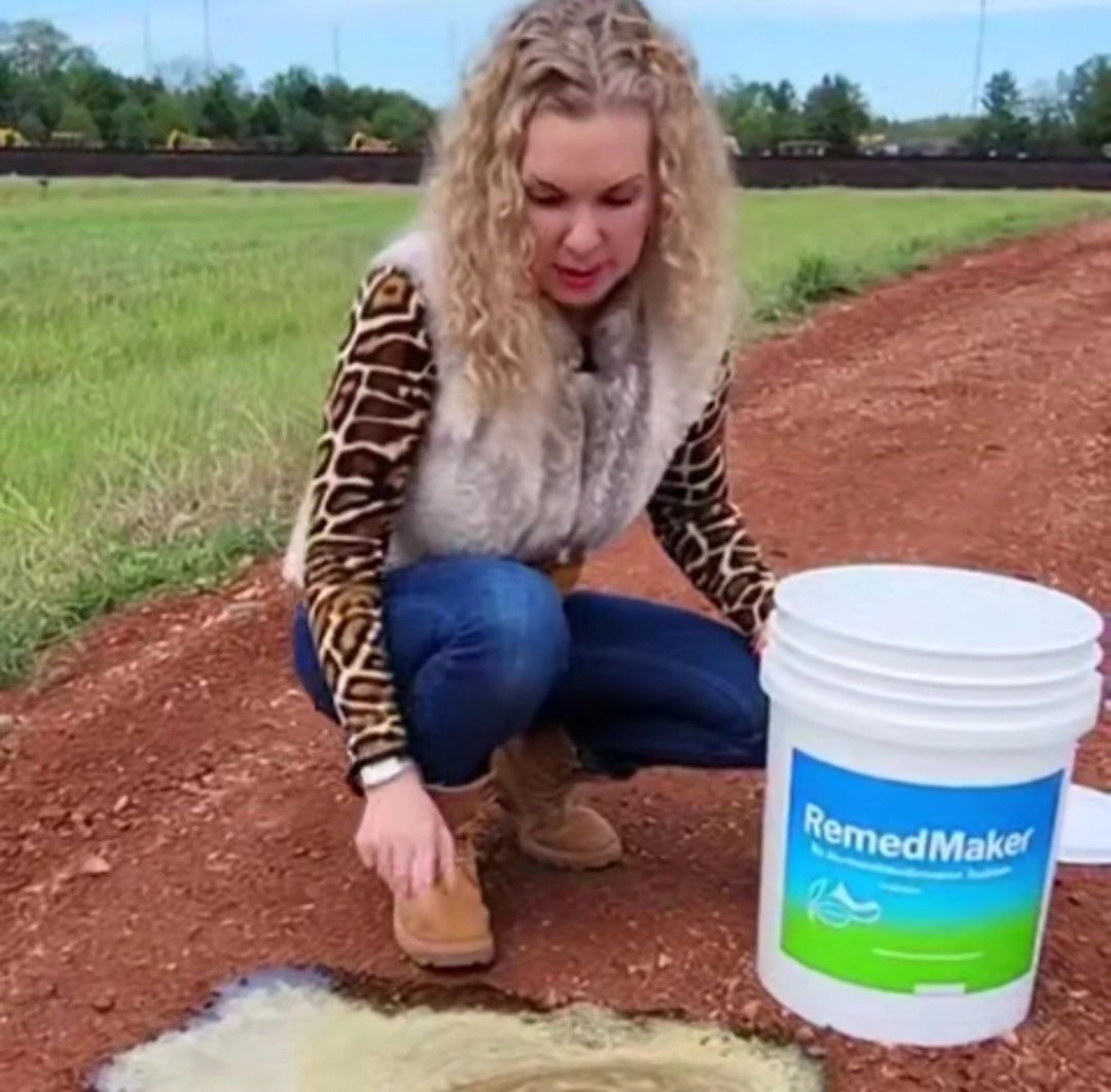Woman with RemediMaker bucket field